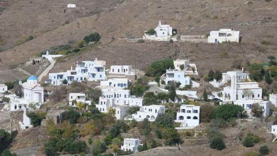Karya on hill with houses in the front