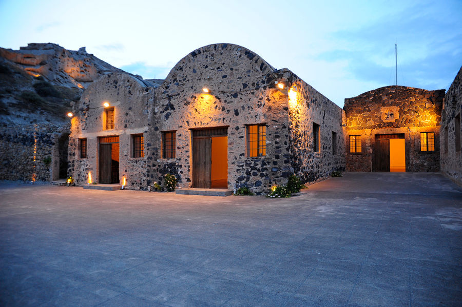 view of stone parts of the building of 'Tomato Industrial Museum' in the evening