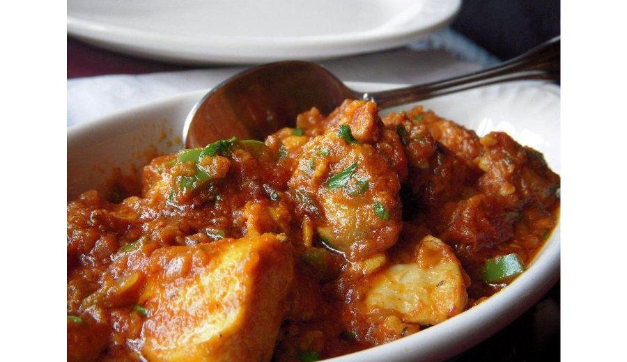 close-up of Greek ‘Yiahni’ is a dish with vegetables or potatoes cooked with tomato sauce and sautéed onions