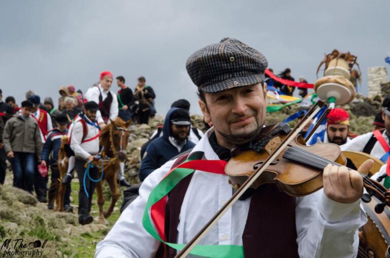 a man smiling and play violin