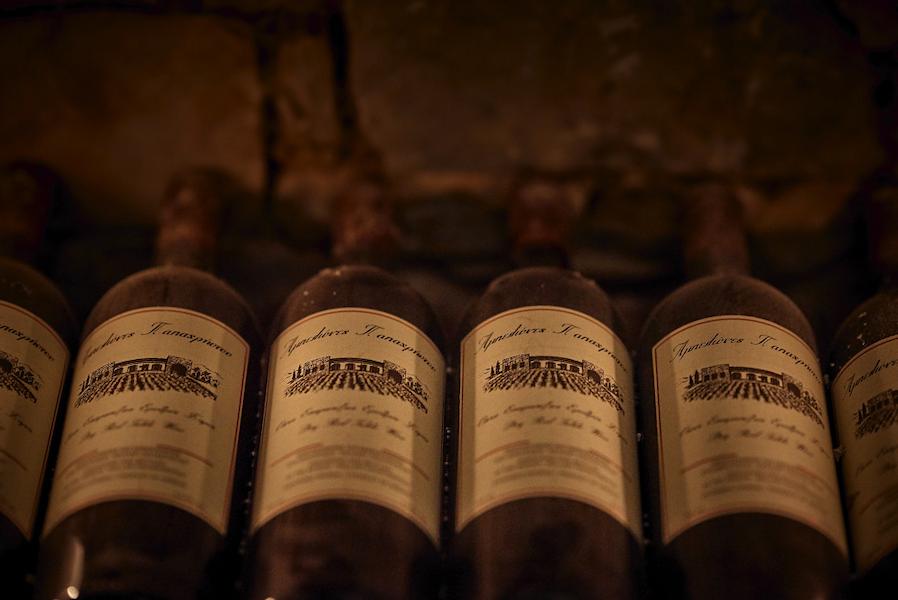 aged wine bottles at kellari Papachristou|