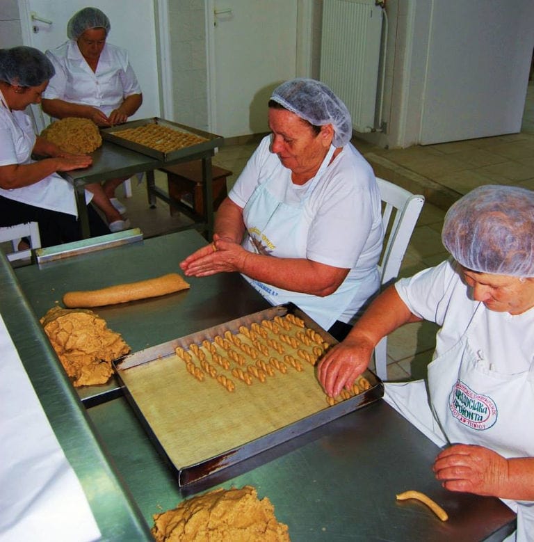 women making 'kuluraki' Greek Easter cookies at 'Agios Antonios Women’s Agri Cooperative'