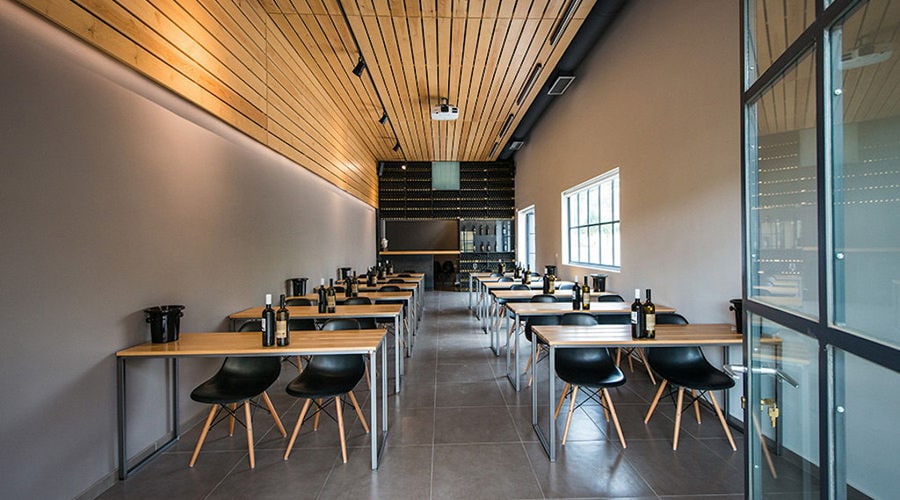 'Alexakis Winery' tasting room with tables and chairs