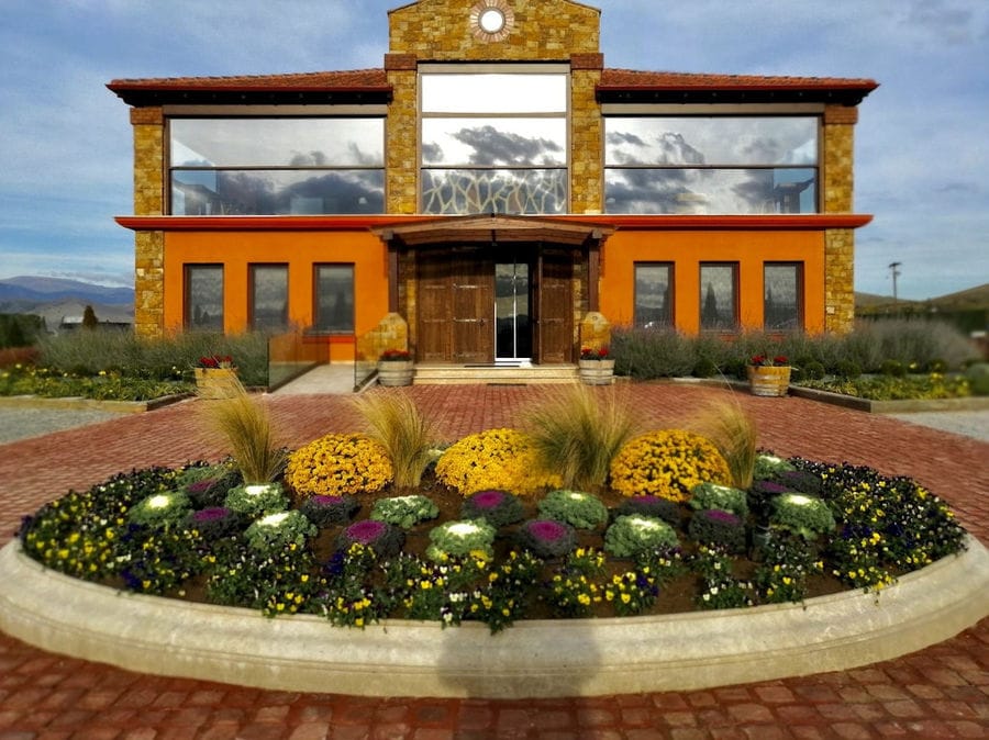 Alpha Estate entrance outside with stone pavement and flowers in the front