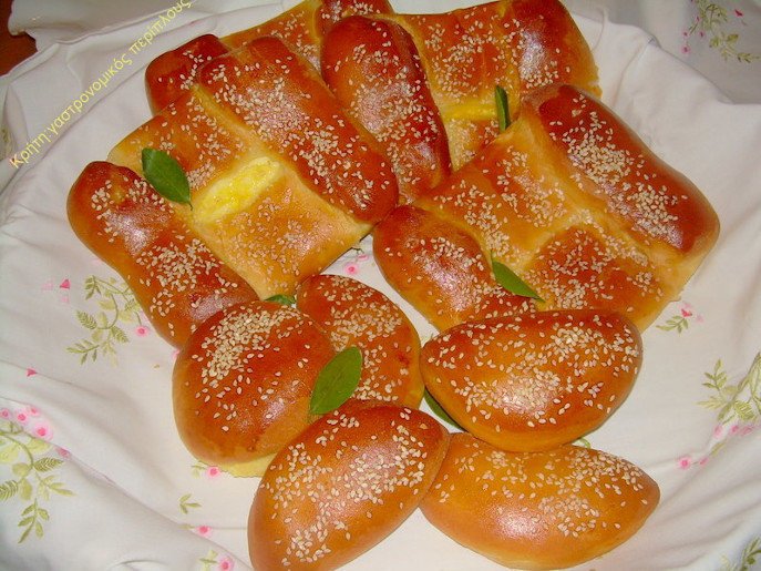 close-up of sweet Greek ‘kalitsounia’ like small cheese pies baked in oven