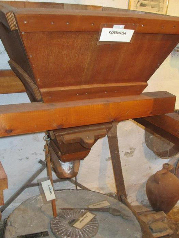 old wooden grape press and ceramic amphora at Aristaios' farm