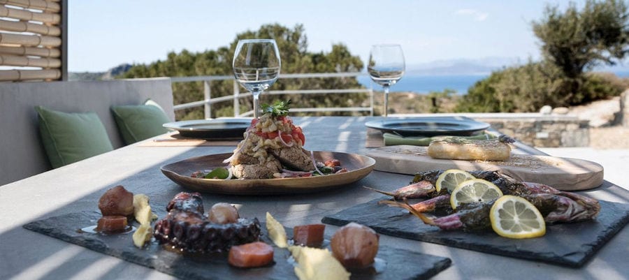 plates with cooked fish and octopus and salad from 'Astarti'