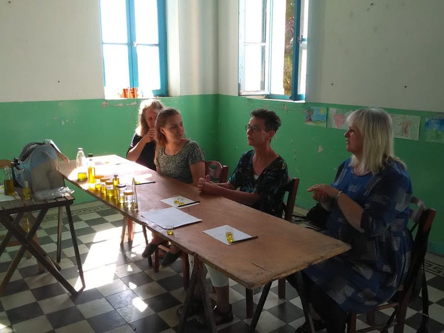four women sitting on the table and tasting olive oil at 'Astarti'