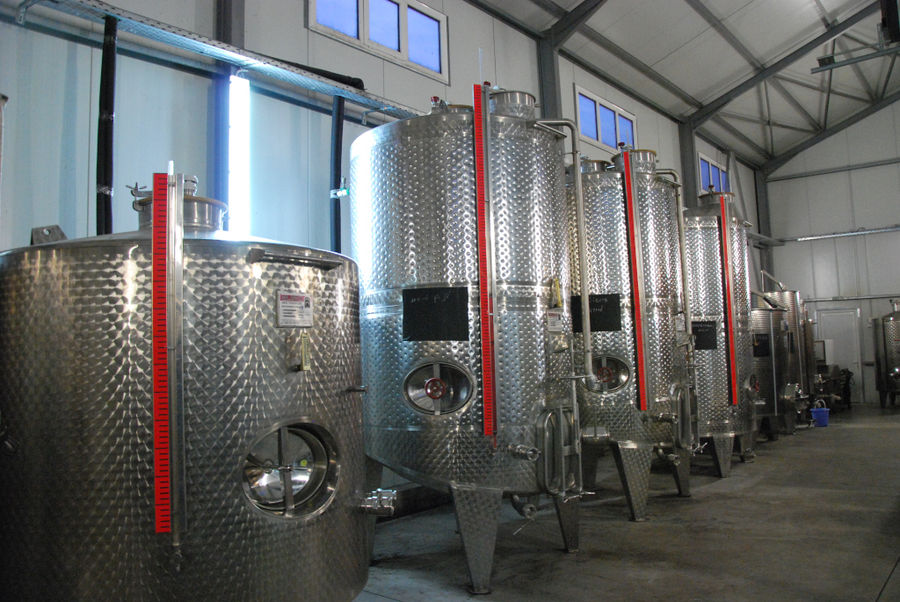 lying aluminum wine storage tanks at 'Belidis Vineyards' plant