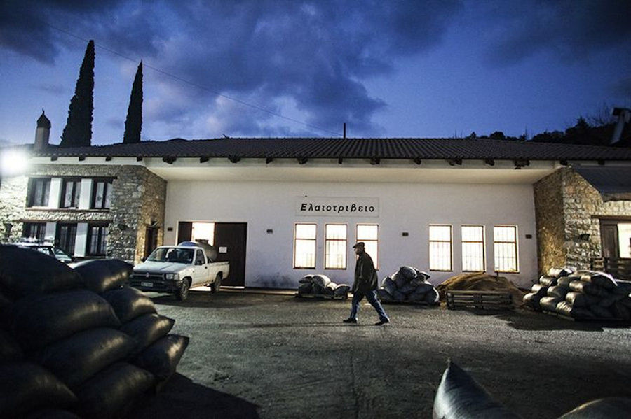 raffia bags and man in front of the building's Ben Olive Mill