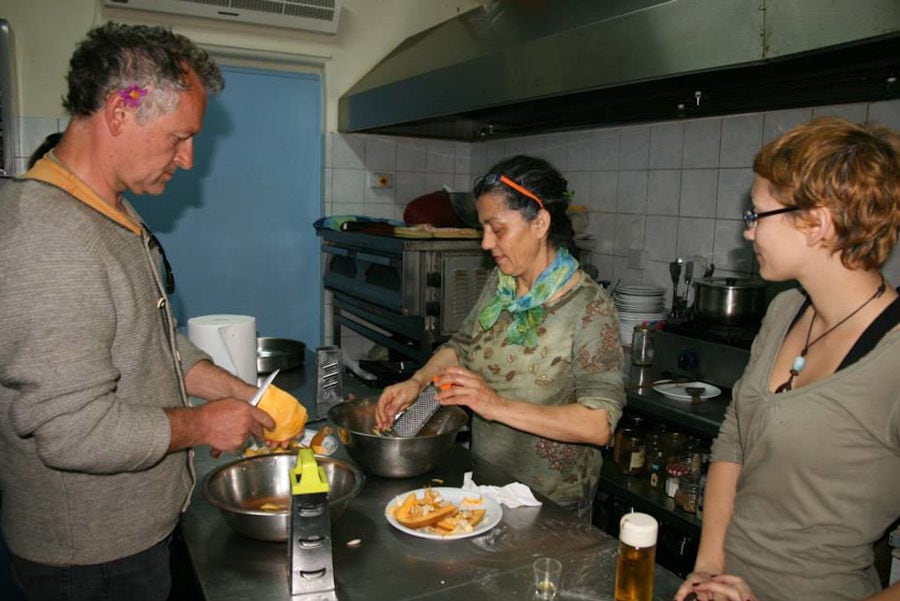 man and women cooking on metallic table at Bioporos