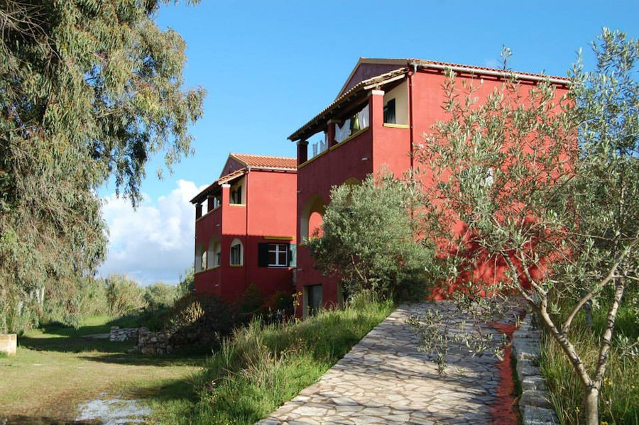 red building and trees at Bioporos