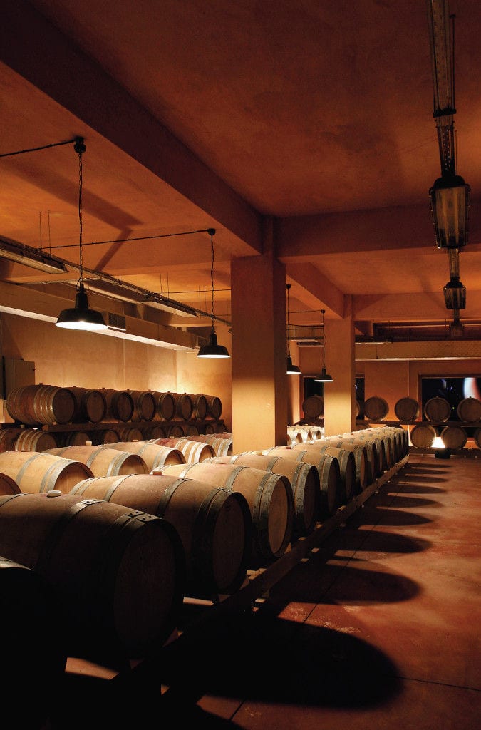 wine wood barrels on top of each other at Boutari Crete Winery cellar