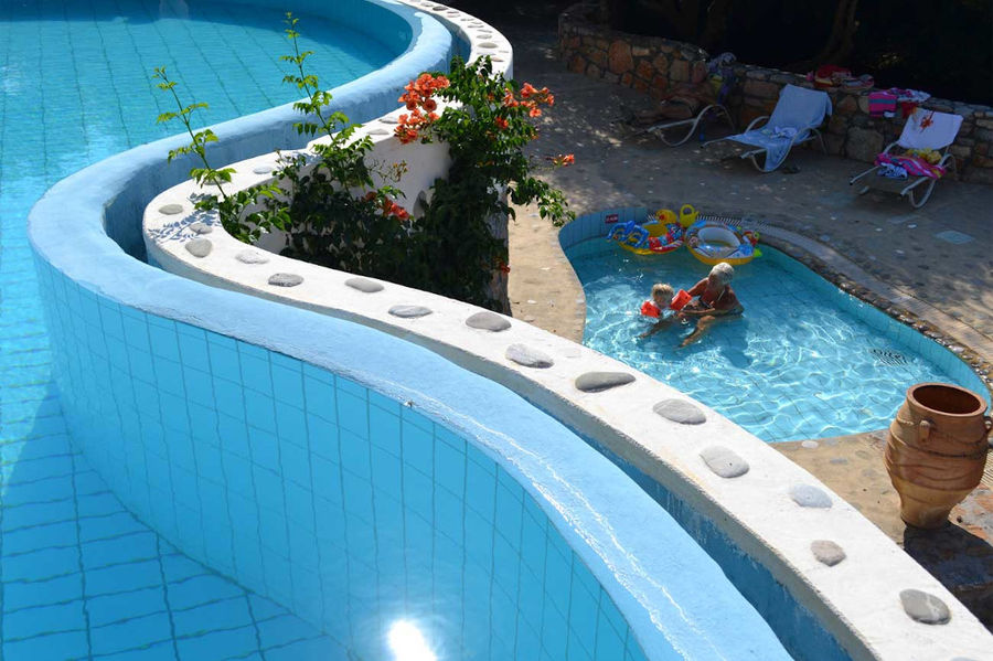 woman and child playing in the Country Hotel Velani's pool