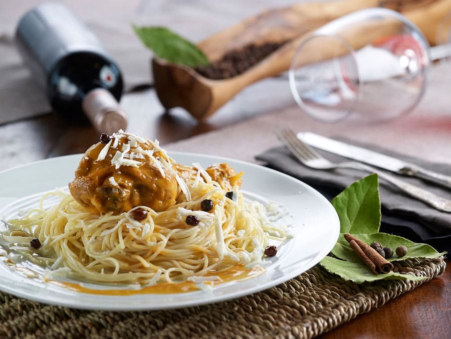 meet with pasta, black olives and sauce at Country Hotel Velaniuntry Hotel Velani