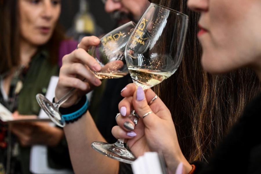 Close-up of a couple tasting white wine