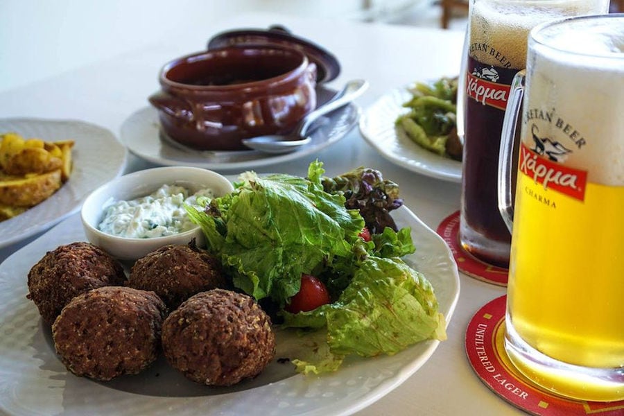 plate with meetballs, green salad and beer at Cretan Brewery