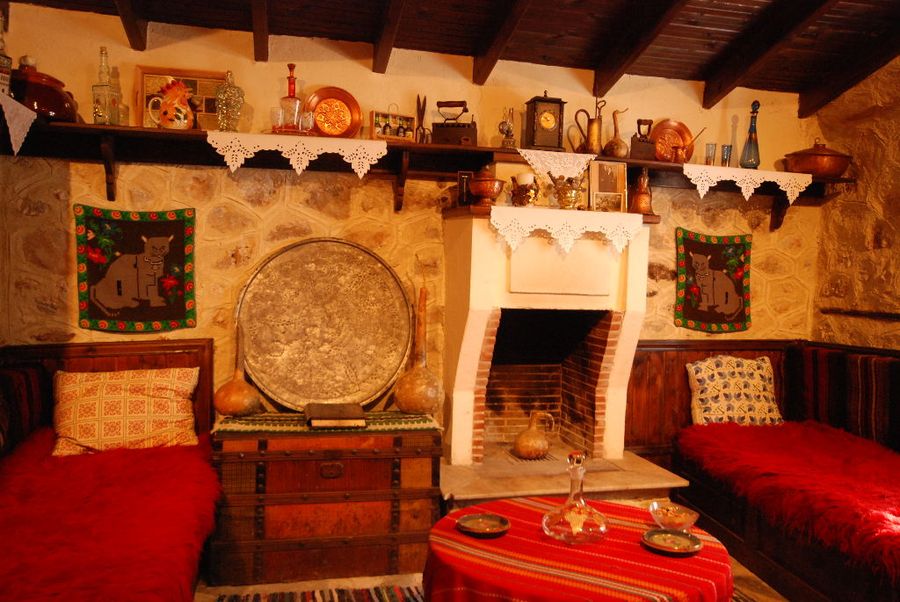exhibition folklore room with wood ceiling at 'Dio Fili' with old traditional bads and fireplace