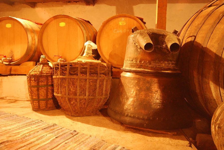 old wine barrels and wine jugs at 'Dio Fili' winery
