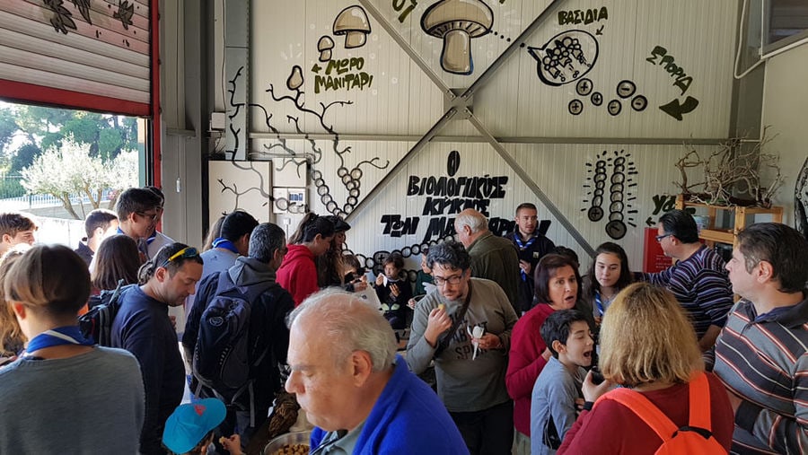 group of tourists eating soup of mushrooms inside of 'Dirfis Mushrooms' facilities