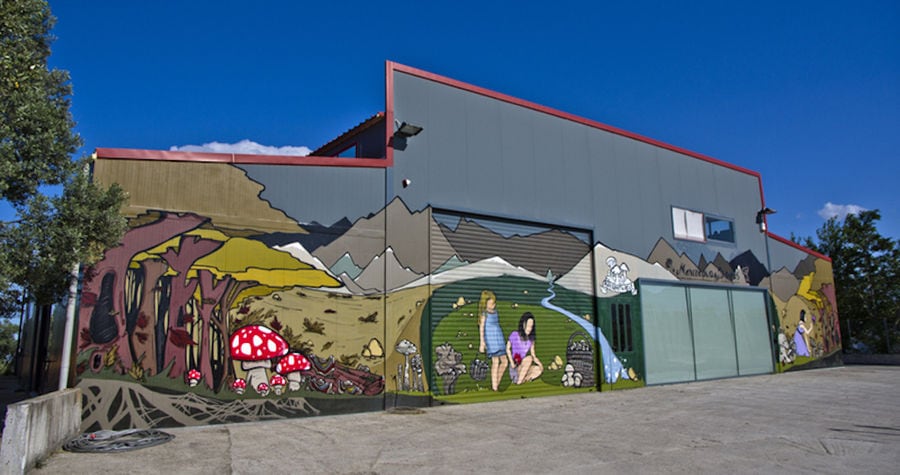 outside 'Dirfis' painted walls represents mushrooms and girls picking them