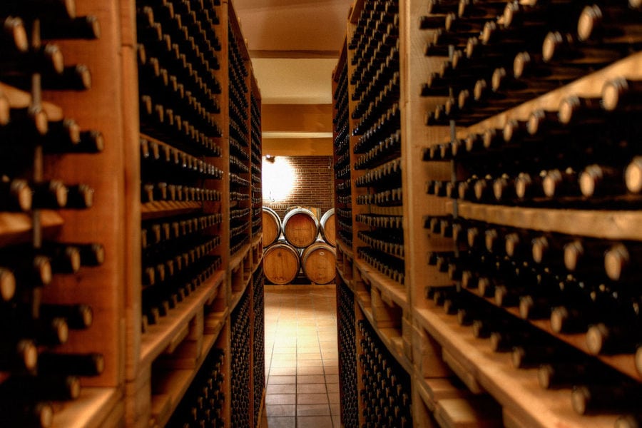 wine bottles on top of each other in the storage locker at 'Domaine Skouras' cellar
