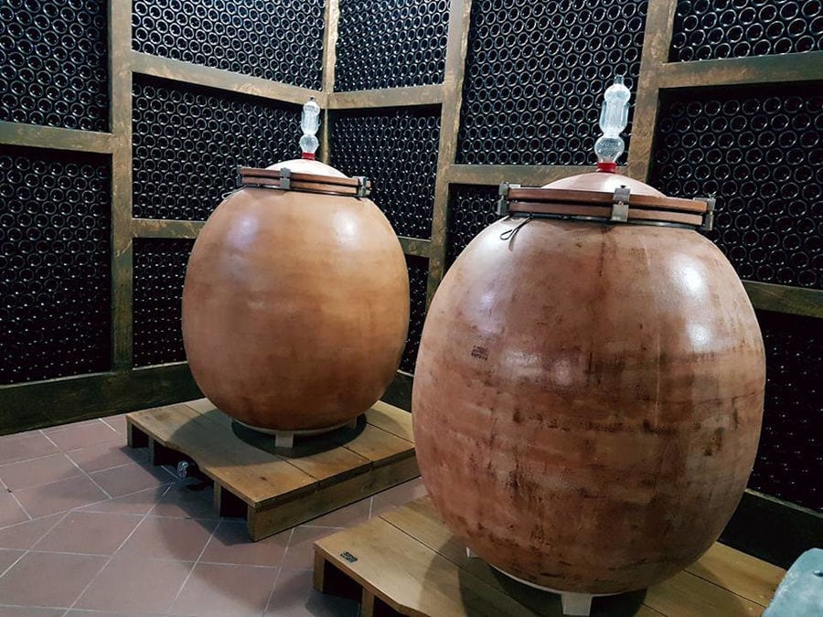 two wine amphoras on the wood panels at 'Domaine Bairaktaris' cellar