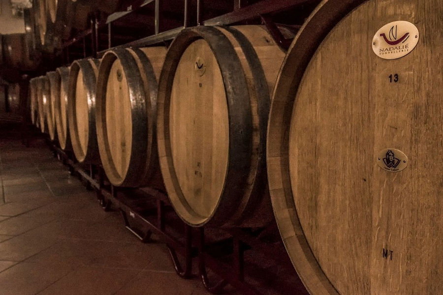 personalized wooden wine barrels sign with the 'Domaine Bairaktaris' logo into the cellar