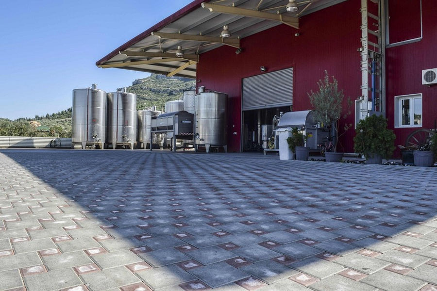 on side of 'Domaine Bairaktaris' winery with outside wine storage tanks