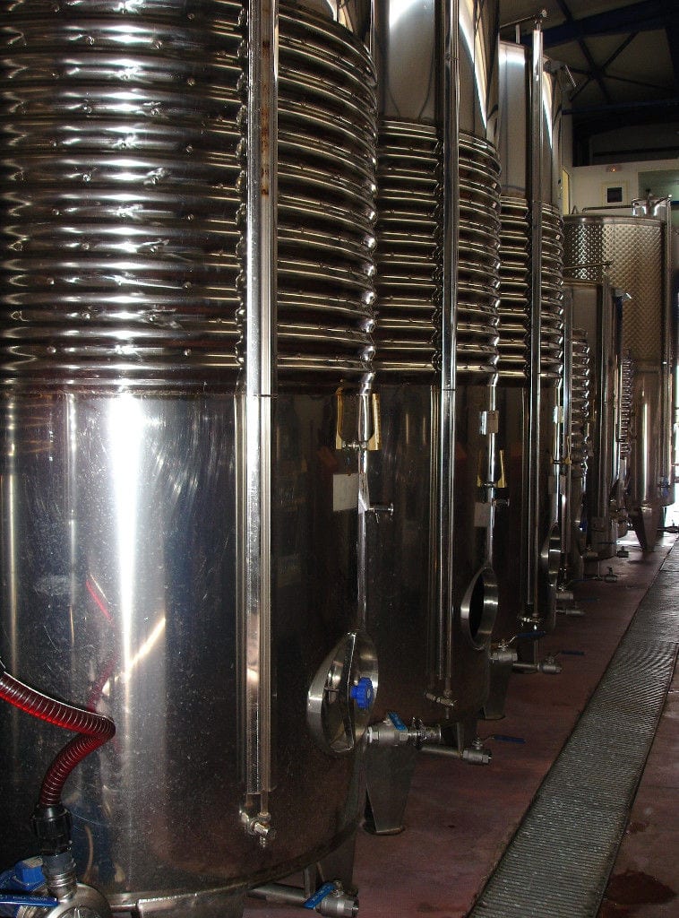 lying aluminum wine storage tanks at 'Domaine Mitzifiris Bio Wines' plant