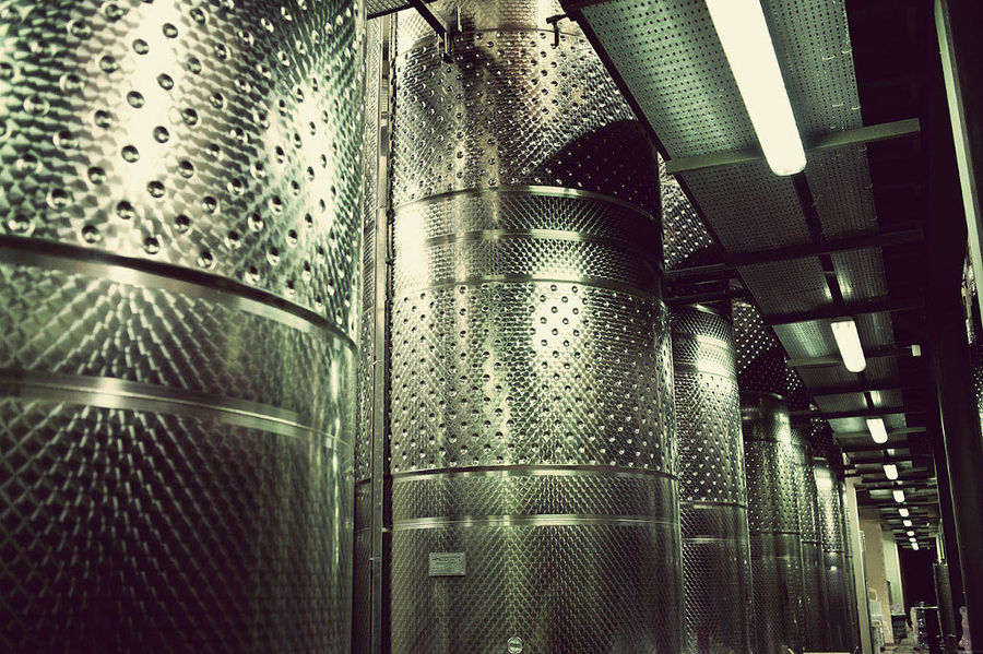 view of the midle of aluminum wine storage tanks at Domaine Papagiannakos plant