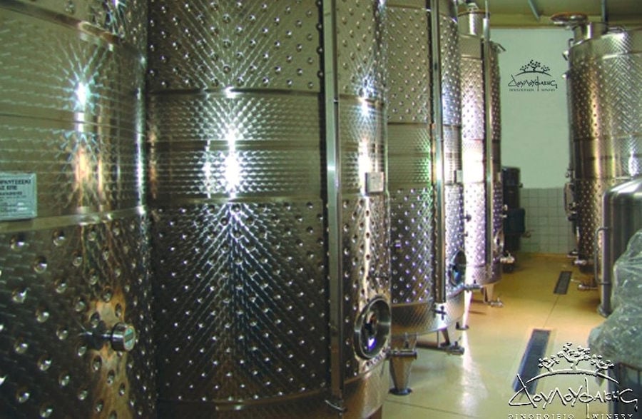 lying aluminum wine storage tanks at Douloufakis Winery plant