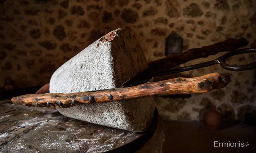 close-up of traditional stone olive press at 'Olive Oil Museum, Ermionis Bairaktaris Apiary'