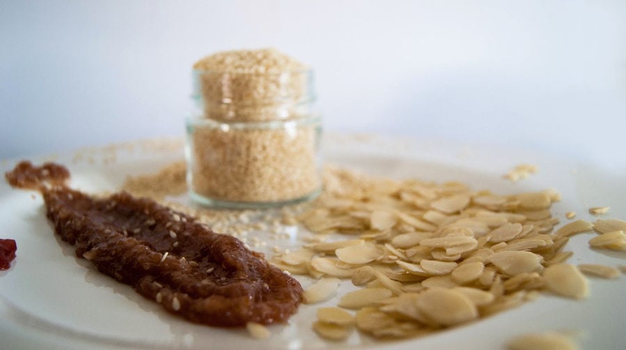 close-up of a plate with fig jam and shelled almonds from Figland