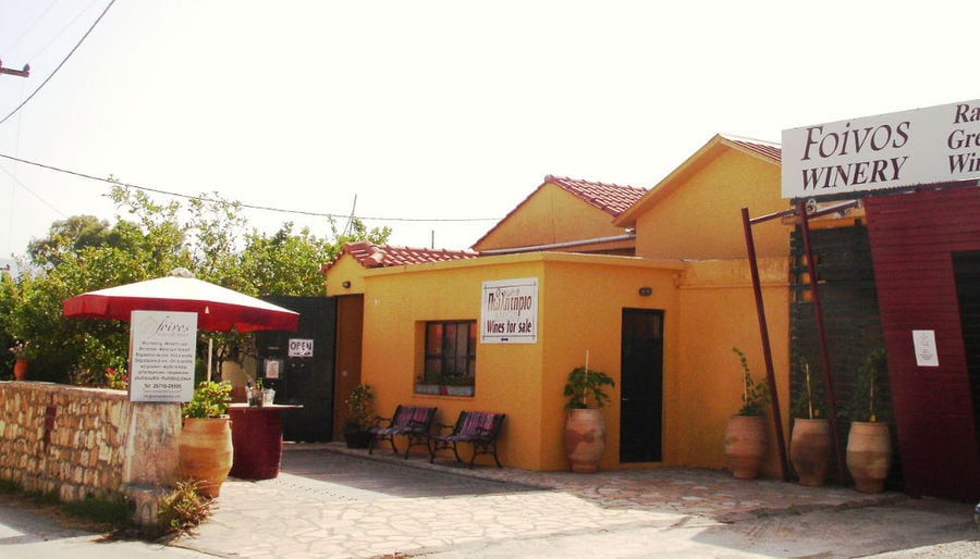 front view of the building that says 'FOIVOS WINERY' in upper part of the wall