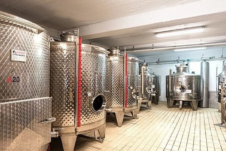 lying aluminum wine storage tanks at Gavalas Winery plant