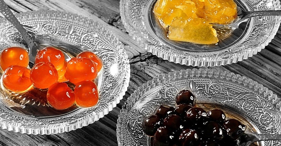 Glass plates with ‘Spoon sweets’ are sweet preserves from fruits