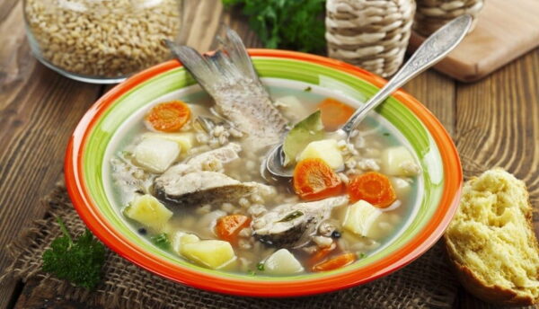 plate with Greek ‘Kakavia’ means soup with boiled onions