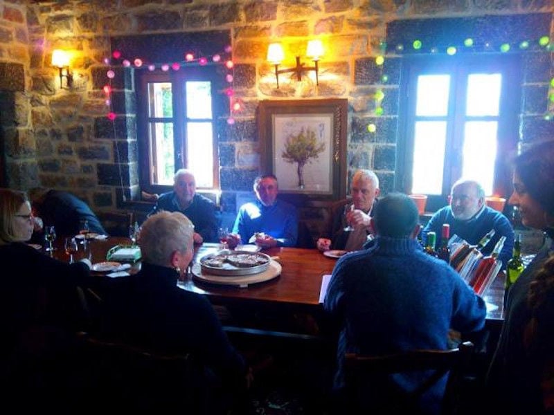 tourists sitting and tasting wines at Kalogris Winery tasting room