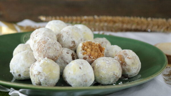 close-up of Greek sweet balls ‘Karidota’ covered with sugar powder