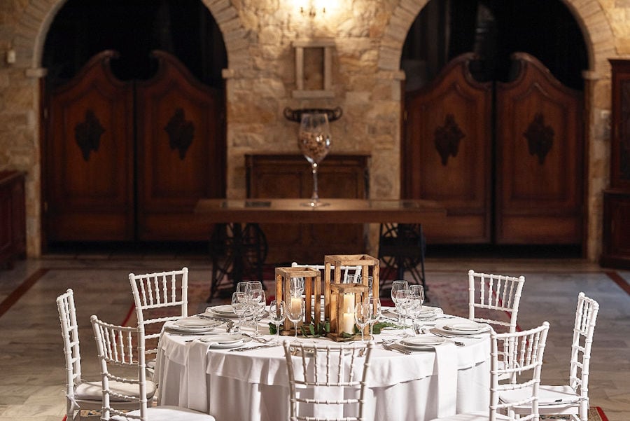 white table with plates and glasses front Kellari Papachristou cellar