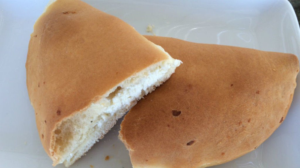 close-up of half of Greek ‘koukoulopita’ is filled with white cheese