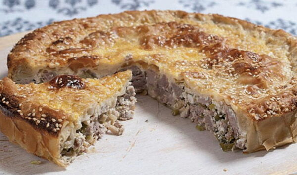 Close-up of pieces of Greek ‘Kreatotourta’ means pie with mixture of lamb and chees baked in oven
