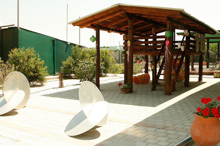 wood watchtower surrounded by pavements at Efkarpia Farm