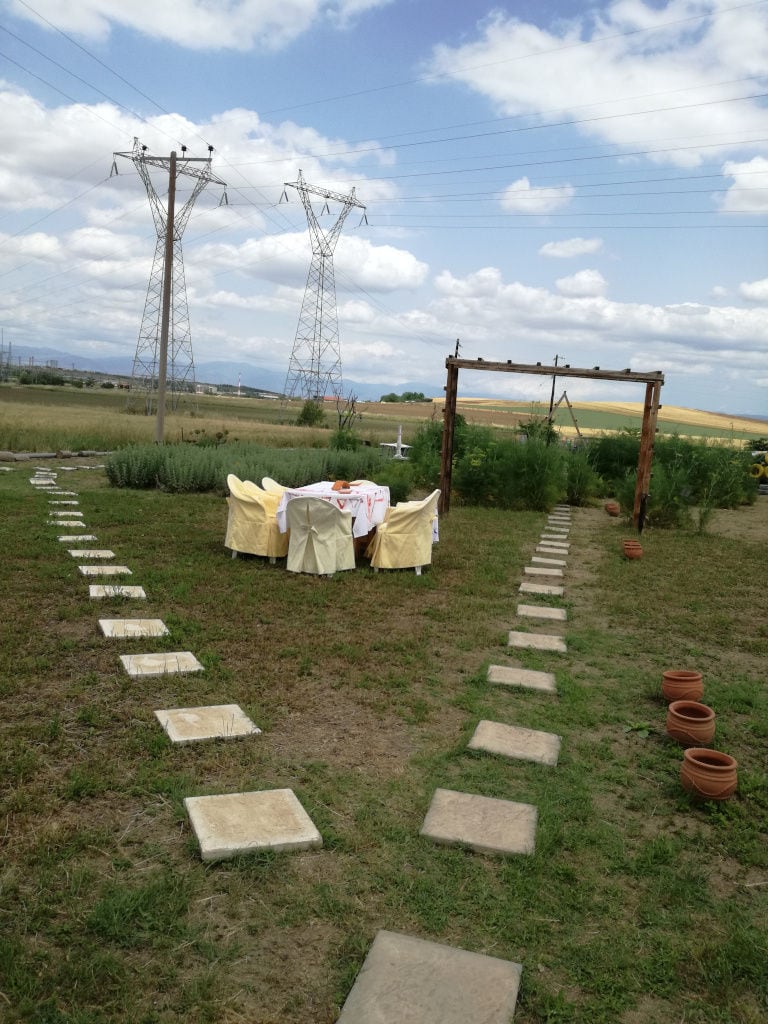 table with chairs in nature at Efkarpia Farm