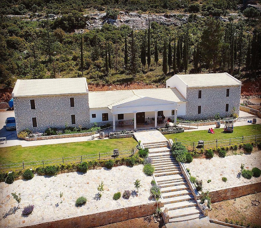 Ktima Karamitsos building from above with stone steps and green lawn on the both sides