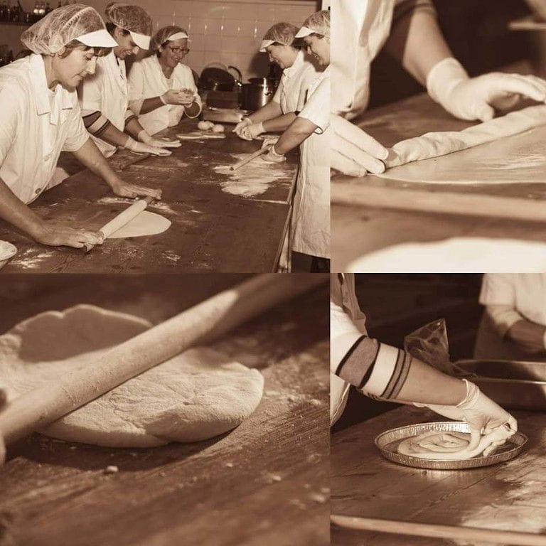 women using wood dough paddles to make spiral pies at Ktima Perek workshop
