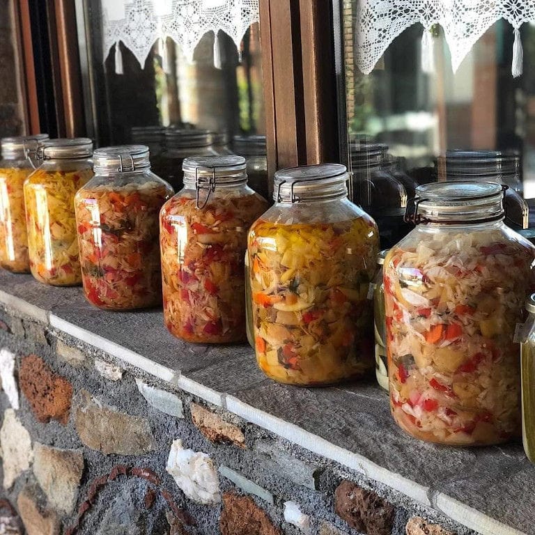 glass jars with pickles on the statment of the window at Ktima Perek