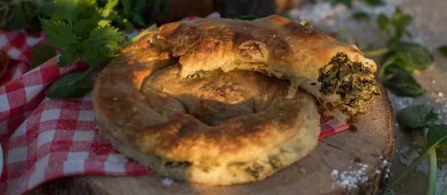 close-up of spanakopita Greek spiral cheese pie and spinach at Ktima Perek restaurant