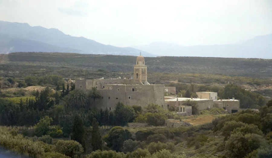 'Ktima Toplou' monastery with her tower surrounded by vineyards, trees and sea
